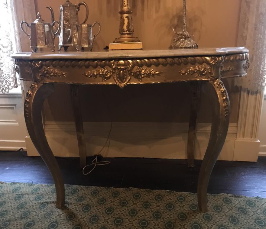 American Rococo table American Rococo carved gesso and giltwood, marble-topped table. Cabriole legs with medallions and flower designs. Turtle shaped top of white marble.