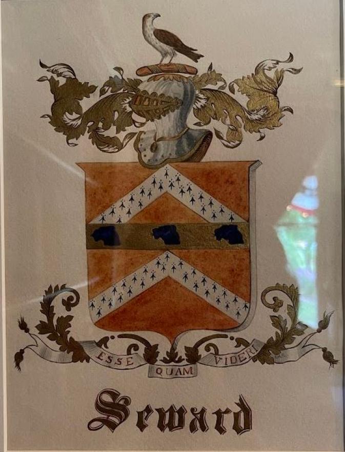 Seward Coat of Arms, in watercolor with family motto "Esse quam videri."  Mounted in a white and gilt frame.