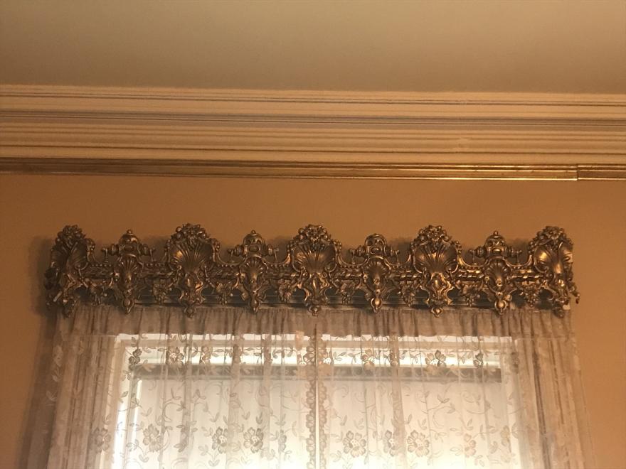 American Rococo pressed brass window pelmets with repousse (metal hammered into relief) shell, foliage, flower and strapwork motifs.  