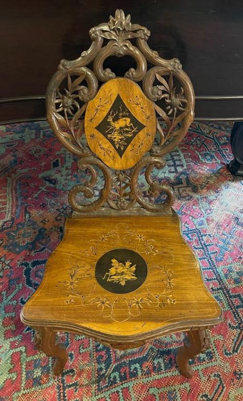 Naturalistic twig-carved openwork back centering a stag on inlaid navette-shaped medallion.  Serpentine seat with circular medallion.  Cabriole legs.