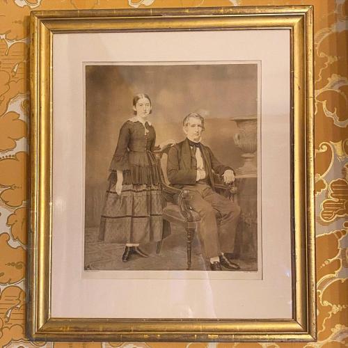  (imperial photograph) mounted behind glass in gilt frame. Seward seated and Frances standing. “58” on bottom right corner of frame.